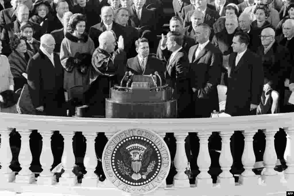 Kennedy is sworn in as the 35th U.S. president by Supreme Court Chief Justice Earl Warren in front of the Capitol in Washington D.C., on January 20, 1961.