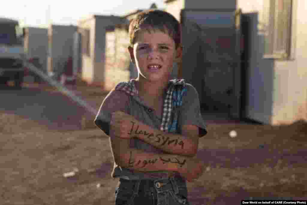 "I love Syria." As of September 2013, Zaatari refugee camp housed more than 100,000 Syrian refugees, making it the world's second-largest refugee camp.