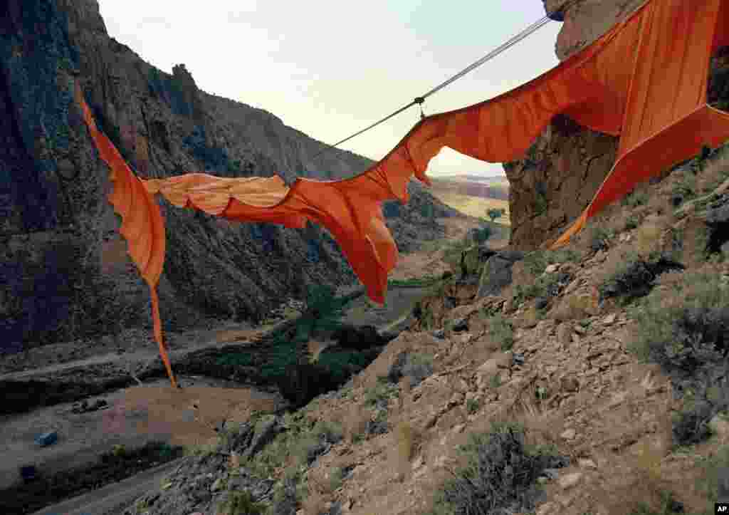 In 1972, Christo hung 6 tons of fabric hundreds of meters above Rifle Gap near the small community of Rifle, Colorado, for his Valley Curtain installation. The artwork -- which cost $750,000 -- hung for just over 24 hours before being shredded into ribbons by the wind.