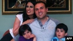 An undated picture of dual U.S.-Iranian citizen Saeed Abedini with his wife Naghmeh and their two children. He has been imprisoned in Iran since 2012.