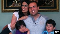 An undated picture of dual U.S.-Iranian citizen Saeed Abedini with his wife Naghmeh and their two children. He has been imprisoned in Iran since 2012. 