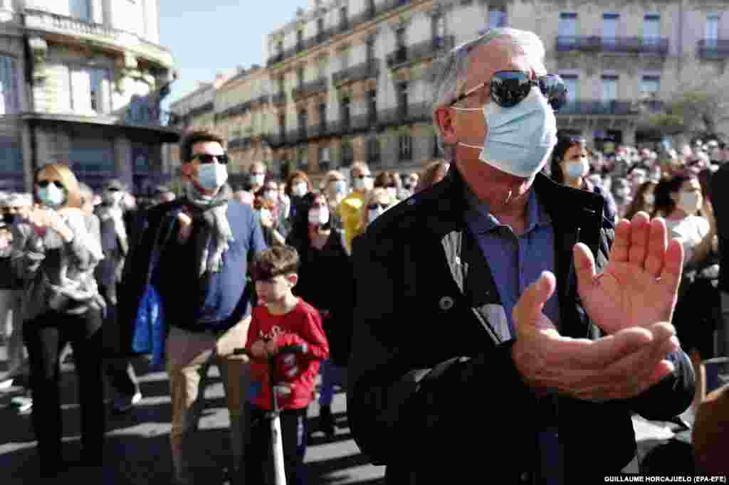 People gather during a demonstration to pay their respect to a history teacher Samuel Paty in Montpellier, October 18, 2020.&nbsp;