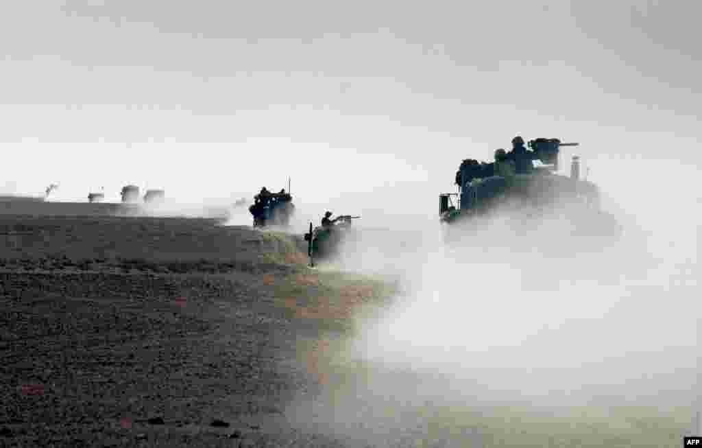 U.S. Marines cross the border from Kuwait into Iraq on March 21, 2003.