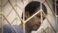Volodymyr Balukh appears in court in Crimea in July 2018.