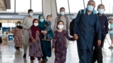 Families evacuated from Kabul arrive at Washington Dulles International Airport in 2021.