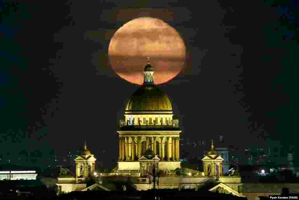 A full moon shines over St. Isaac&#39;s Cathedral in St. Petersburg, Russia. (TASS/Peter Kovalev)