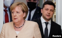 German Chancellor Angela Merkel (left) and Ukrainian President Volodymyr Zelenskiy after their meeting in Kyiv earlier this month.