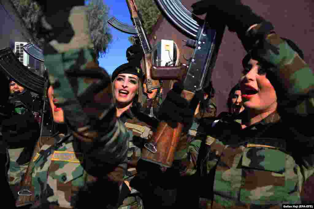 Female Peshmerga officers celebrate after their graduation ceremony at the Zakho military academy in Iraq's Kurdistan region. (epa-EFE/Gailan Haji)
