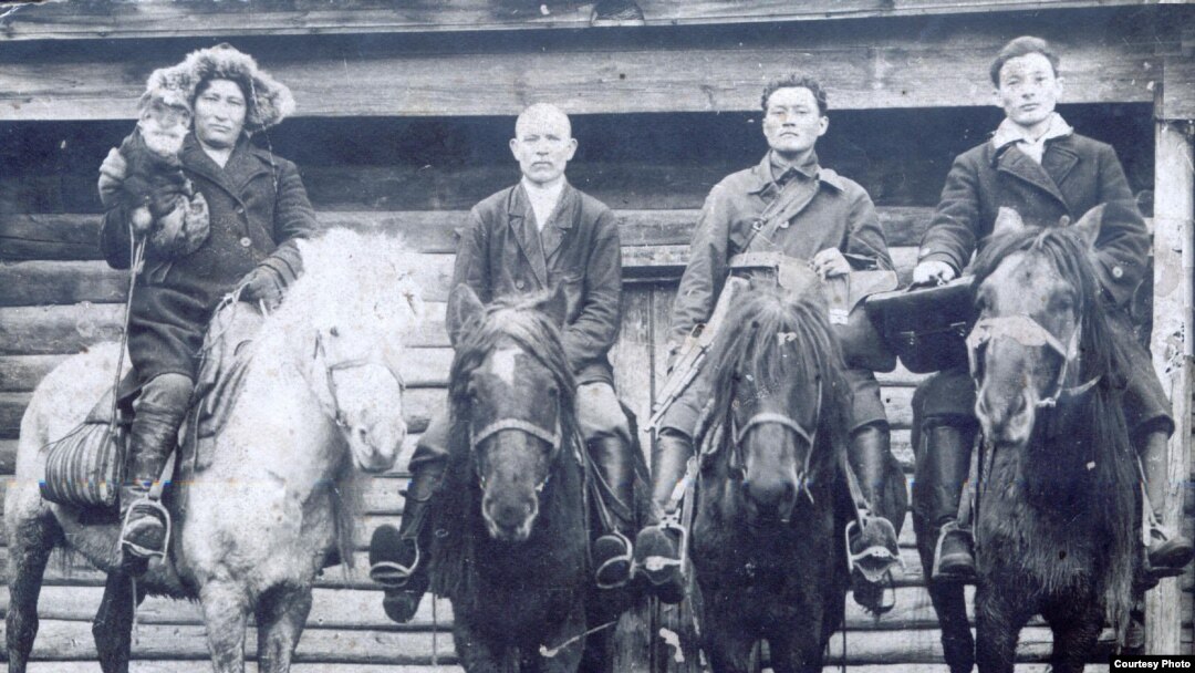 Parkizat Sharipzhan (far right) with relatives, local leaders in village of Zhana-Zhol (1939-40)