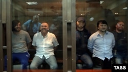 Rustam Makhmudov (far left in photo from Moscow city court on June 9) was given life in prison for pulling the trigger, and Lom-Ali Gaitukayev (second from left) got a similar sentence for organizing the killing. The other three defendants got between 12 and 20 years in jail for their roles.