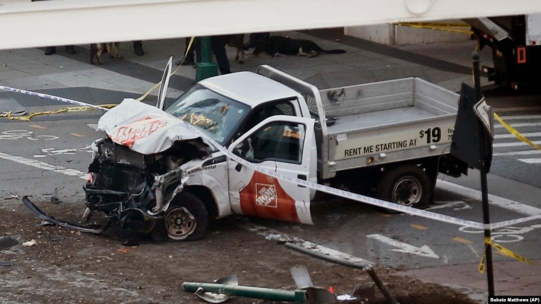 Police tape rests on a damaged Home Depot truck after a man drove onto a bike path near the World Trade Center memorial on October 31 in New York City.