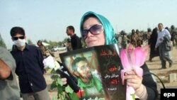 A woman mourns a relative who was killed during Iran's postelection turmoil at Behesht Zahra Cemetery outside Tehran.