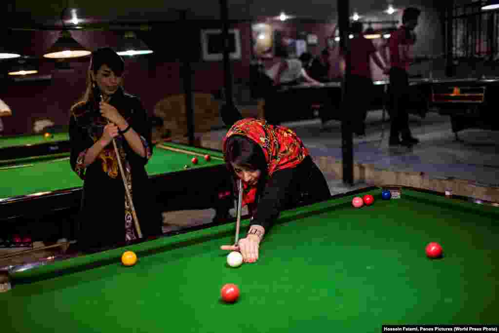 Women play pool in a men&#39;s-only gym in Iran. Long-Term Projects -- Second Prize (Hossein Fatemi, Panos Pictures)&nbsp;