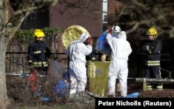 Forensic workers in the center of Salisbury, where Sergei Skripal and his daughter were found.