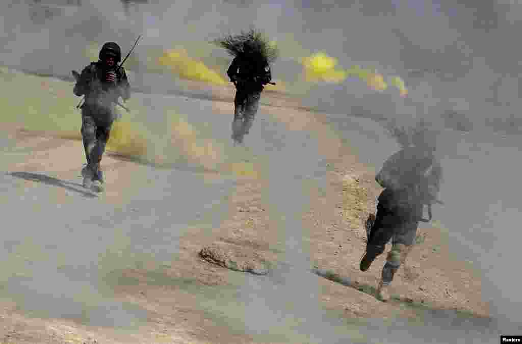 Afghan National Army (ANA) officers take part in a training exercise at the Kabul Military Training Center in Kabul. (Reuters/Omar Sobhani)