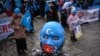 Uyghur protesters who have not heard from their families living in Xinjiang hold placards and Uyghur flags during a protest against China in Istanbul last month.