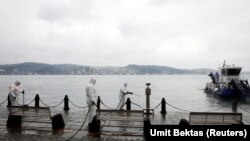 Turkey A worker sprays disinfectant outside Ortakoy Mosque, to prevent, the spread of coronavirus disease (COVID-19), in Istanbul.