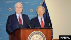 U.S. Senators McCain (left) and Lieberman address a press conference at a previous stop in Baghdad on July 3.