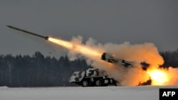 Belarus -- An army Smerch (Tornado), Soviet-made heavy multiple rocket launcher, fires during exercises in the Brest region, 25Jan2011