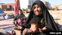 Afghanistan - Bibi Gul, a displaced person from Baghdis Province, is living at an IDP camp by the roadside in Herat. screen grab video 