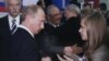 Masha Drokova (right) meets her idol, Vladimir Putin.