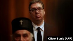 Српскиот претседател Александар Вучиќ и поглаварот на СПЦ, Иринеј, архивска фотографија.