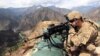 FILE: A U.S. soldier looks through his sniper scope in the province of Kunar in eastern Afghanistan.
