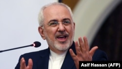 PAKISTAN -- Iranian Foreign Minister Mohammad Javad Zarif gestures while speaking at the Iran-Pakistan Business Forums in Karachi, March 13, 2018