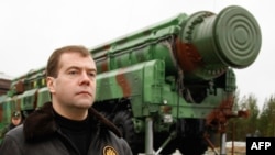 Russia's Dmitry Medvedev walks near an RS-12M Topol ballistic missile at the Plesetsk space launch pad. (file photo)