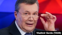 Former Ukrainian President Viktor Yanukovych talks to journalists in Moscow on February 6.