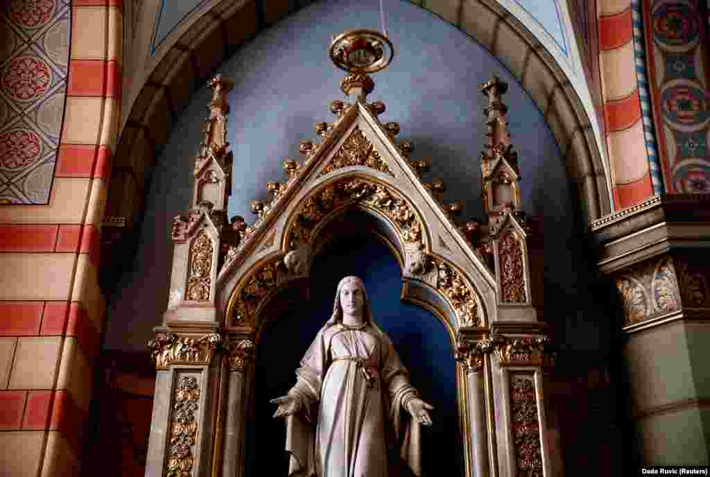 A statue stands inside the 19th century Sacred Heart Cathedral in Sarajevo.&nbsp;