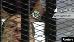 Egyptian TV shows former President Hosni Mubarak in the courtroom for his trial at the Police Academy in Cairo on August 3.