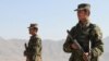 Afghan President Hamid Karzai has announced he is considering replacing Afghanistan's volunteer army with one with manned by conscripts.