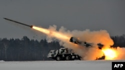 Belarus -- An army Smerch, a heavy multiple rocket launcher, fires during exercises in the Brest region, 25Jan2011