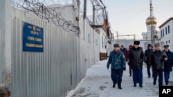 Prison guards walk inside a prison in the town of Kharp, in a photo released by the human rights ombudsman of the Yamalo-Nenets autonomous district on December 15.