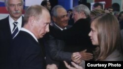 Masha Drokova (right) meets her idol, Vladimir Putin.