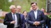 EU foreign policy chief Joseph Borrell (left) and Ukrainian Foreign Minister Dmytro Kuleba talk during a G7 foreign ministers' summit in Weissenhas, Germany, on May 13. 