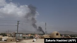 Smoke rises into the air after Taliban militants launched an attack on the Afghan provincial capital of Ghazni on August 10.