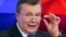 Former Ukrainian President Viktor Yanukovych talks to journalists in Moscow on February 6.