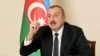 AZERBAIJAN -- Azerbaijani President Ilham Aliyev gestures as he addresses the nation in Baku, December 1, 2020