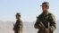 Afghan President Hamid Karzai has announced he is considering replacing Afghanistan's volunteer army with one with manned by conscripts.