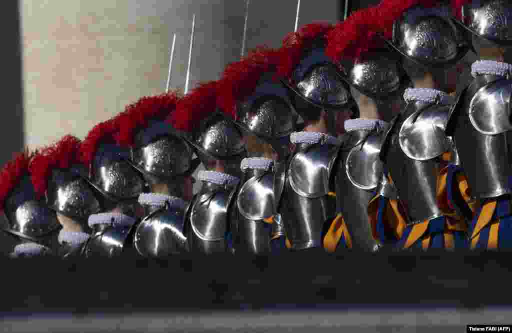 Swiss guards parade before the arrival of the Pope on Saint Peter's Square in the Vatican for the traditional Urbi et Orbi Christmas message to the city and the world on December 25. (Tiziana Fabi/AFP)