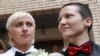 Russia -- Russian lesbian couple Irina Fedotova (2R) and Irina Shapitko (R) exit a wedding registration office in Moscow on 12May2009. 