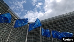 Belgium - European Union flags flutter outside the European Commission headquarters in Brussels, June 5, 2020.