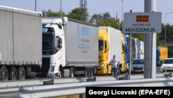 Trucks wait on the border between Serbia and North Macedonia. "I remember in 2007, when there were three or four vehicles at the border...And now, I think it's never under 50 vehicles," says Serbian businessman Dragan Stojsin. (file photo)