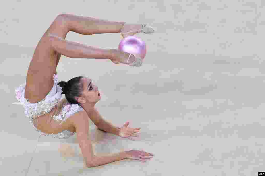 Russia's Margarita Mamun competes in the final event of rhythmic gymnastics. Mamun won the individual all-around gold medal to give Russia its fifth consecutive title in the event. The 20-year-old edged Russian teammate Yana Kudryavtseva. Ganna Rizatdinova of Ukraine claimed bronze.