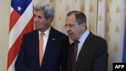 Russia -- Russian Foreign Minister Sergei Lavrov (R) greets US Secretary of State John Kerry during a meeting in Moscow, March 24, 2016