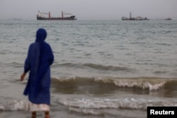 Vessels in the Strait of Hormuz are visible near the beach of Bandar Abbas, Iran (file photo)