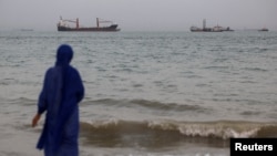 Vessels in the Strait of Hormuz are visible near the beach of Bandar Abbas, Iran. (file photo)