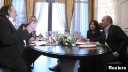 Russian President Vladimir Putin (right) speaks with French actor Gerard Depardieu during their meeting in Sochi in January 2013.